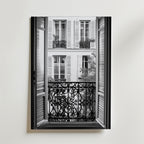 En svartvit Vintage Paris Balcony Poster från Bozetto föreställer ett öppet fönster med dekorativa järnräcken med utsikt över fönsterluckor och små balkonger, tryckt på premiumpapper med en matt finish.