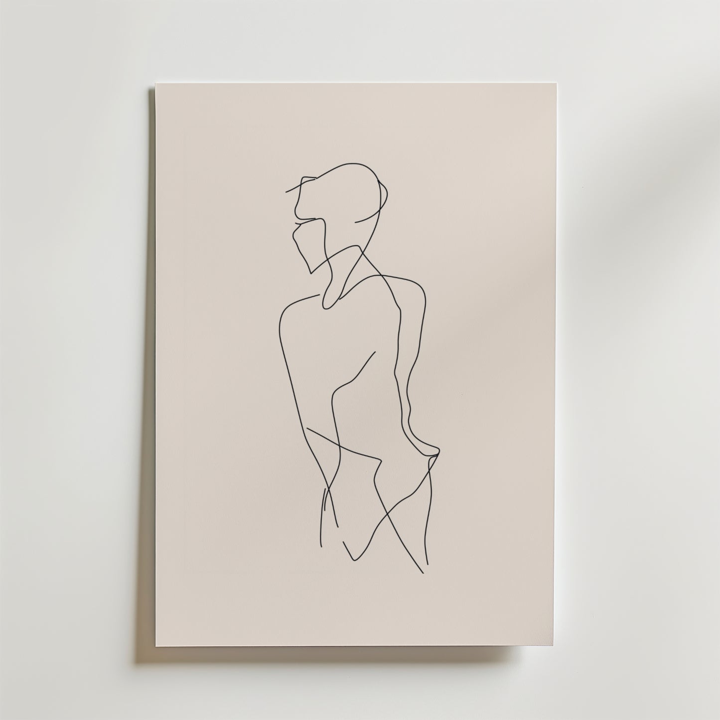 Bozetto Solitary Line Body Poster visar minimalistisk linjekonst av en person i profil, ritad med en enda svart matt linje på premiumpapper mot en ljusbeige bakgrund.