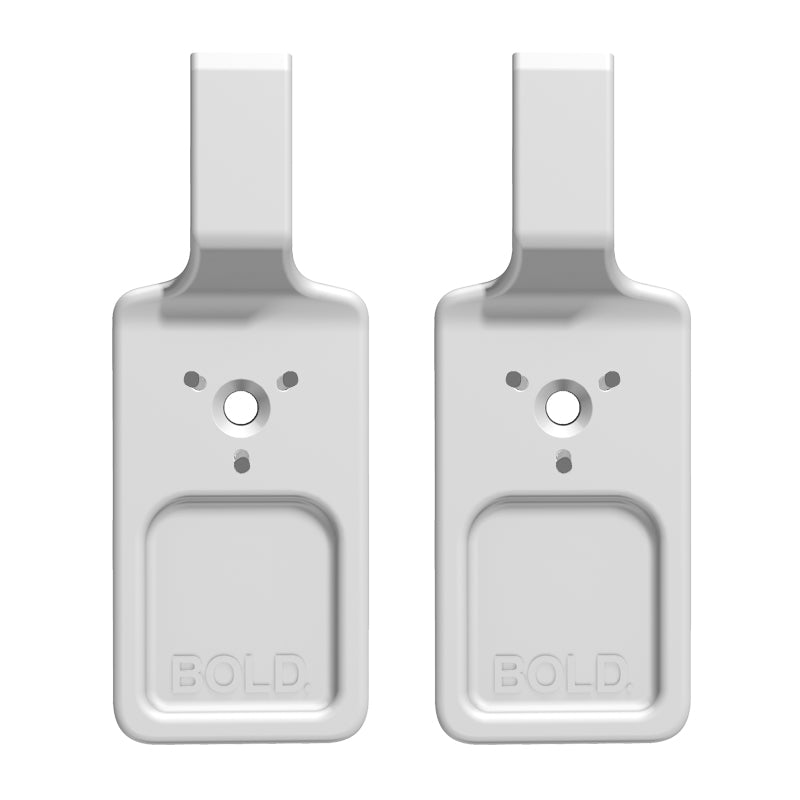 Set med två vita Bozetto Bold Spik Väggkrokar (2x2 kg), var och en med rektangulär bas, centralt cirkulärt hål, tre omgivande hål och "BOLD." präglat längst ner - perfekt för speglar eller tavlor.