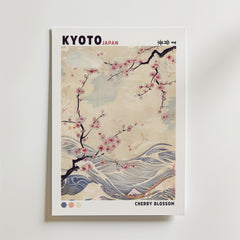 Kyoto Blossom Wave Poster by Bozetto har "KYOTO JAPAN" upptill, grenar av körsbärsblommor, abstrakta vågor och en subtil beige bakgrund. "CHERRY BLOSSOM" visas längst ner till höger. Mjuka pasteller - perfekt för Kyoto-inspirerad inredning.