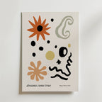 Dreams Come True Poster från Bozetto har abstrakta former i orange, svart, olivgrönt och guld på vit botten, vilket ger en känsla av rörelse. "dreams come true" står det längst ner till vänster med Magic Poster Club i små bokstäver.