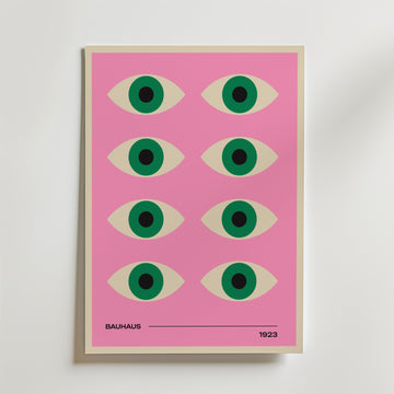 Bozetto Bauhaus Vision Poster har en rosa bakgrund med ett rutnät av åtta stiliserade ögon i kräm, grönt och svart. 